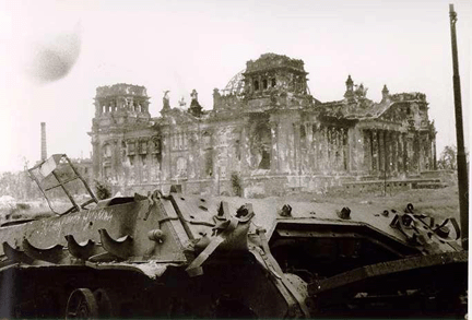 Wrecked tank, German parliament building in background